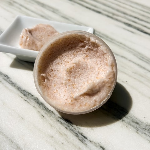 exfoliating polish with a subtle shimmer on a marble surface