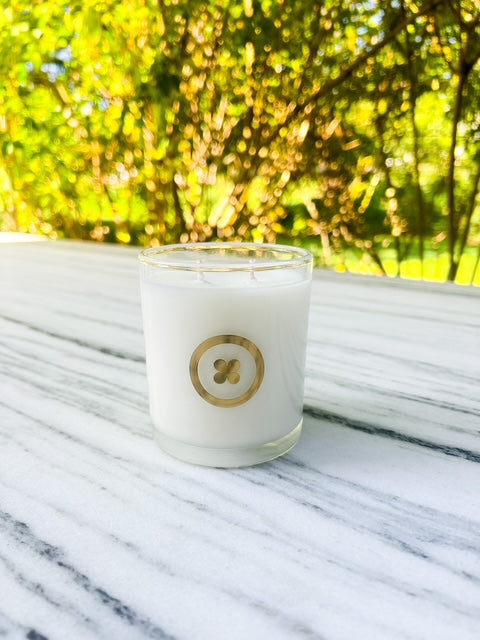 Candle in clear glass tumbler buttonhomeandbody.com