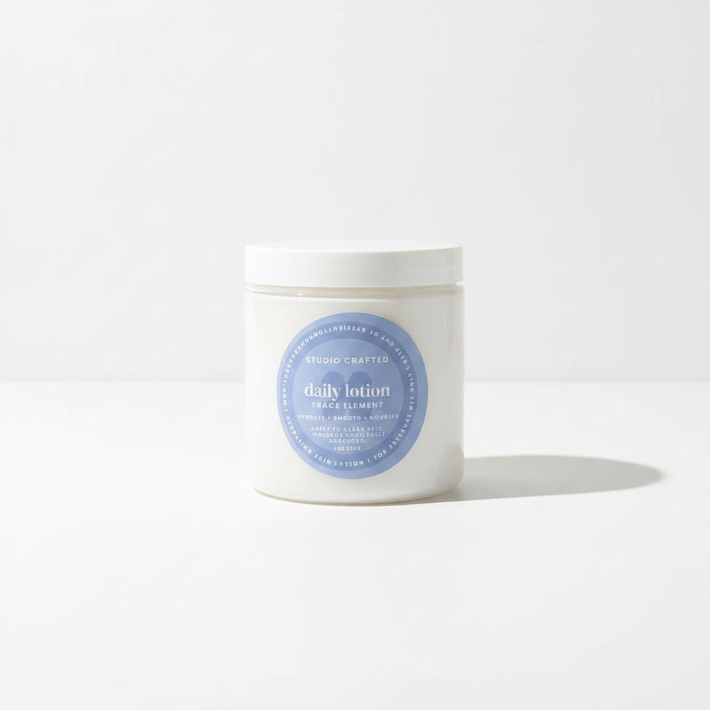 a white jar of daily lotion in trace element fragrance for everyday use.