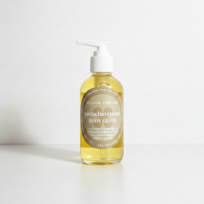 pistachio cream body gloss body oil in a glass bottle with pump
