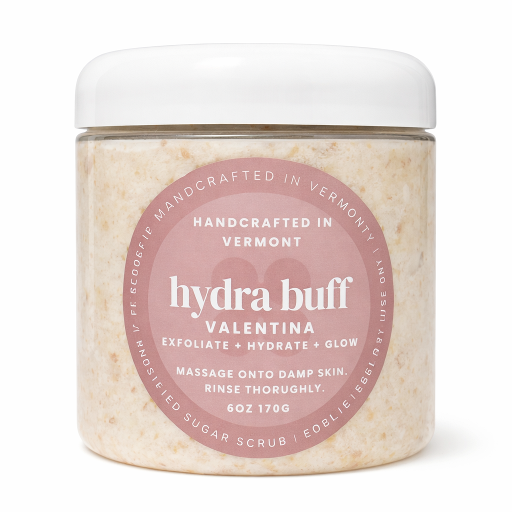 Jar of 'hydra buff' sugar scrub with pink label on a white background 