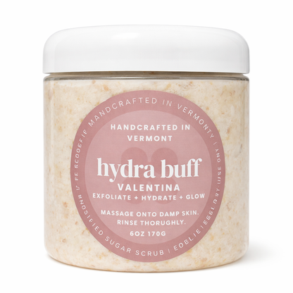 Jar of 'hydra buff' sugar scrub with pink label on a white background 