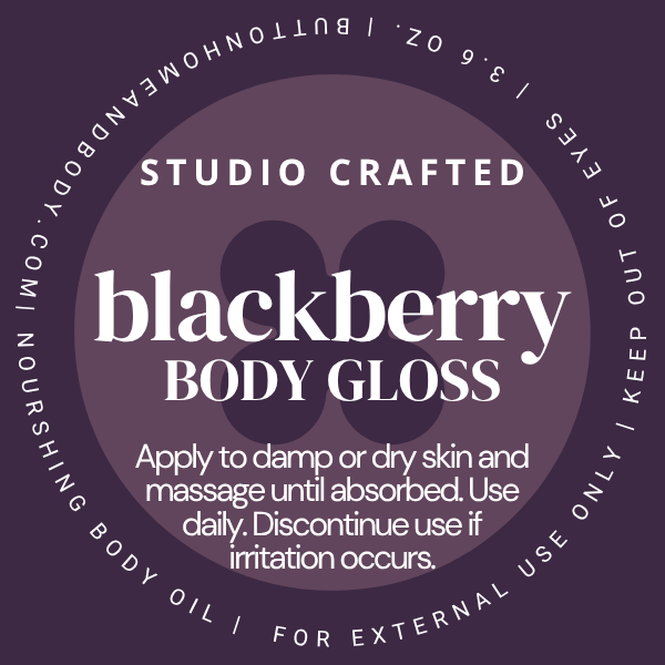 Blackberry Body Gloss body oil label in a rich berry purple with white lettering