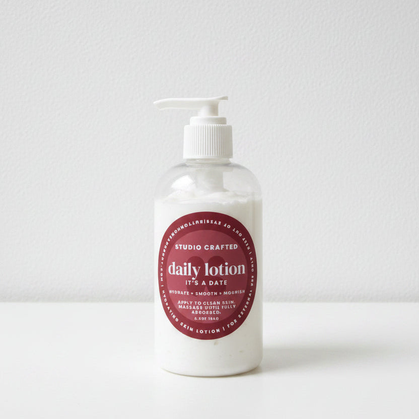 Bottle of daily lotion with a white pump  in a sticky warm fragrance button home and body 