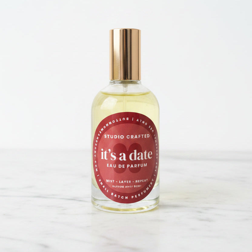 Glass perfume bottle with gold cap sticky sweet warm vanilla date fragrance