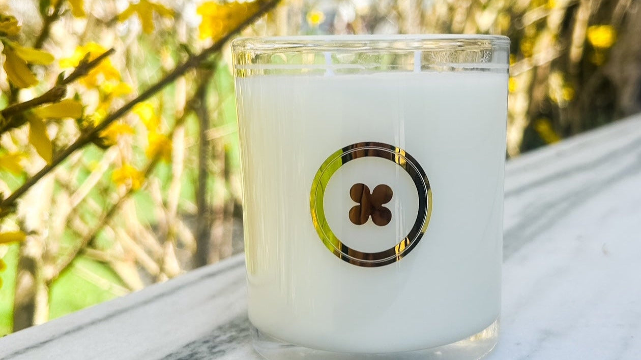  shiny clear glass candle with metallic gold icon 