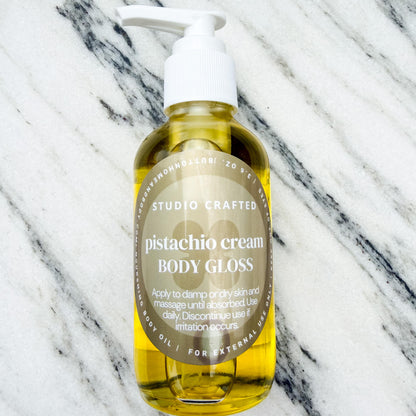 pistachio cream body gloss oil glass bottle
hydrating glow body oil nutty vanilla scent
lightweight body oil with pistachio and almond fragrance