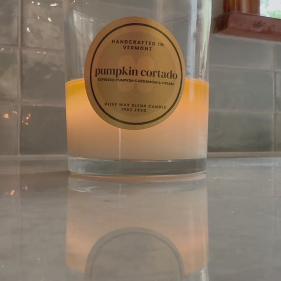 Burning pumpkin cortado candle