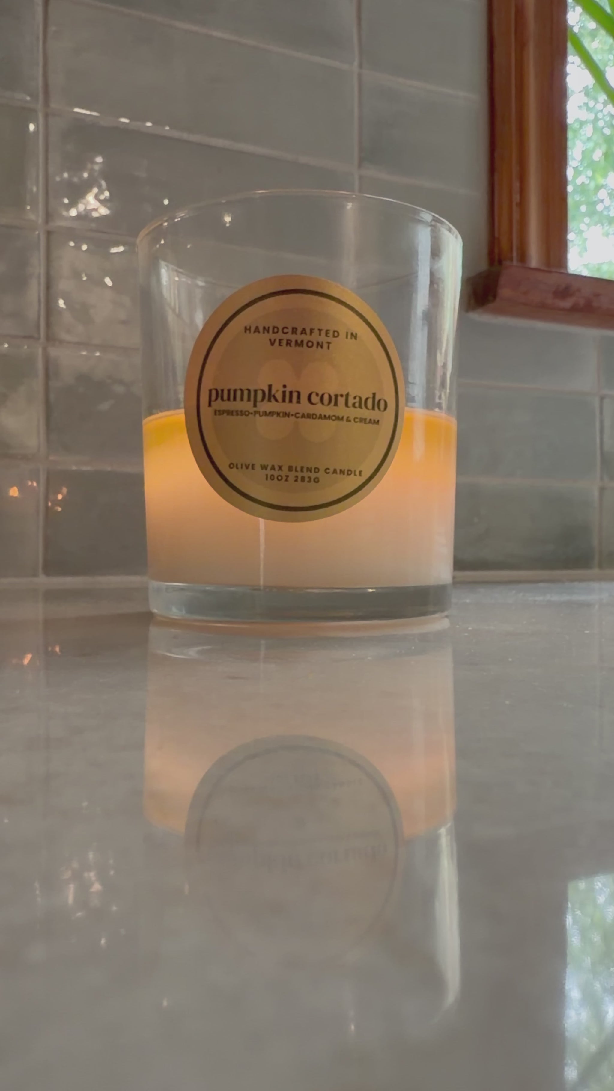 Burning pumpkin cortado candle