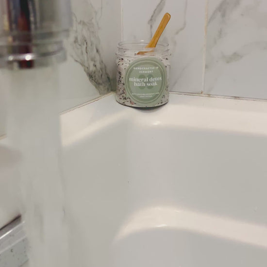 running bath water with product on edge of tub