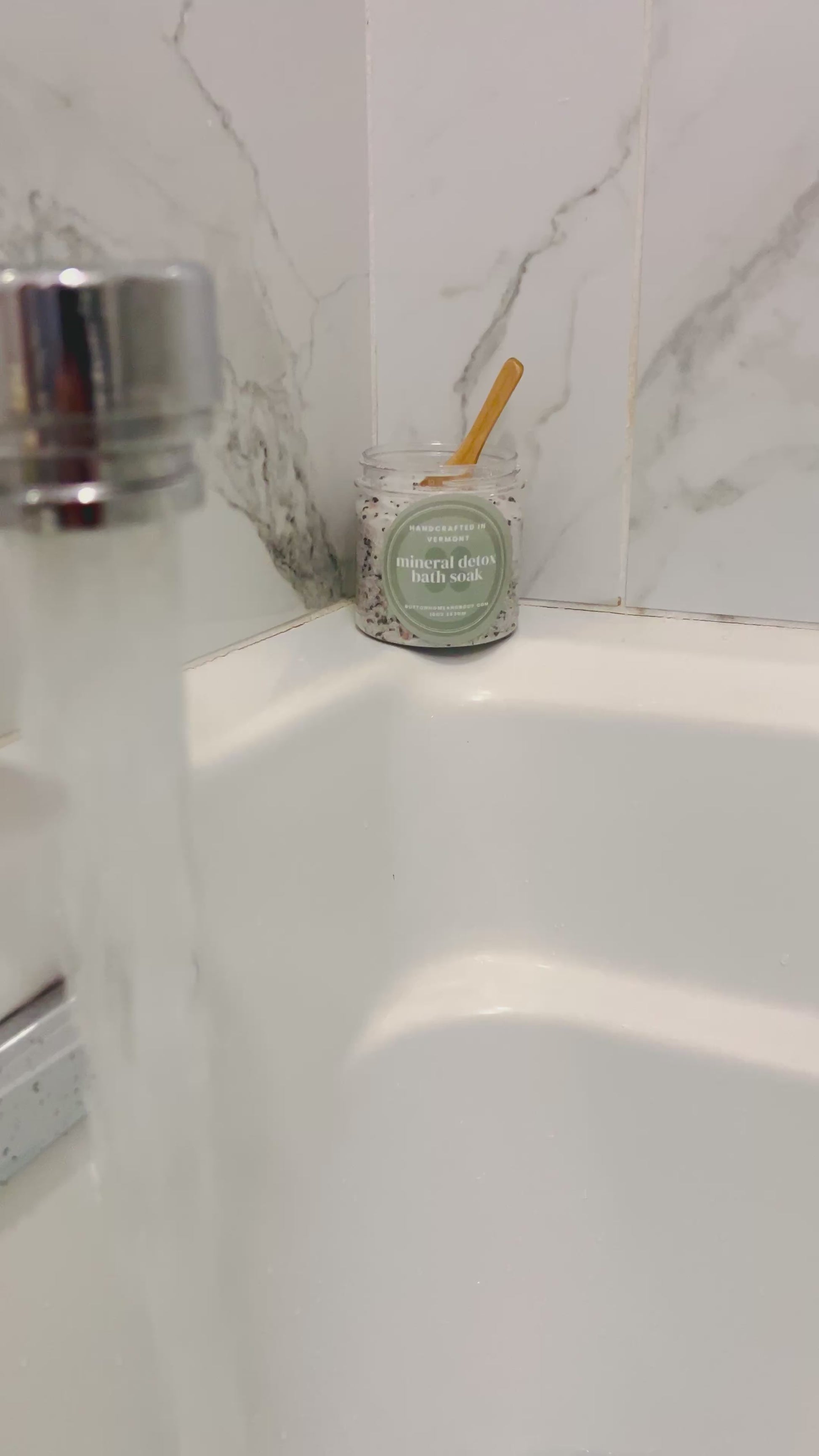 running bath water with product on edge of tub