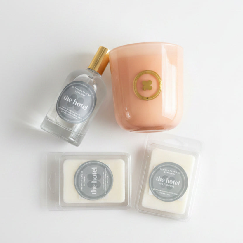 Button The Hotel candle, room spray and wax melts in a luxury hotel-inspired fragrance